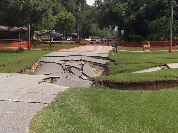 Large Sinkhole Swallows Street And Threatens Homes In Spring